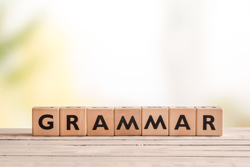 This is a picture of the word grammar spelled with wooden blocks.