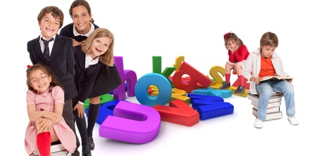 This is a picture of a group of happy kids of varying ages. They are holding books and standing around large computer generated letters.